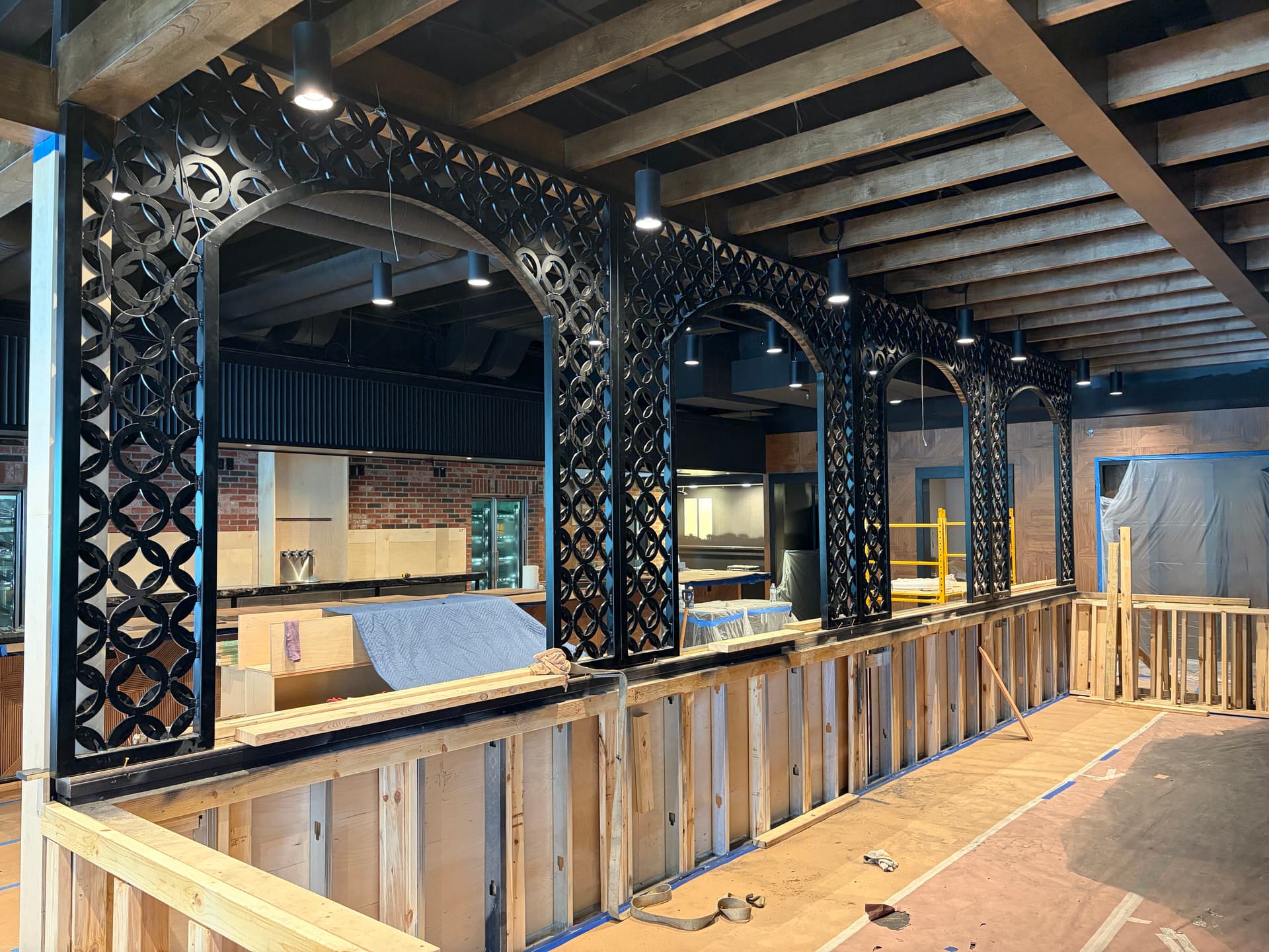 Custom Steel Arch Features Built for Roots Prime in Franklin TN image
